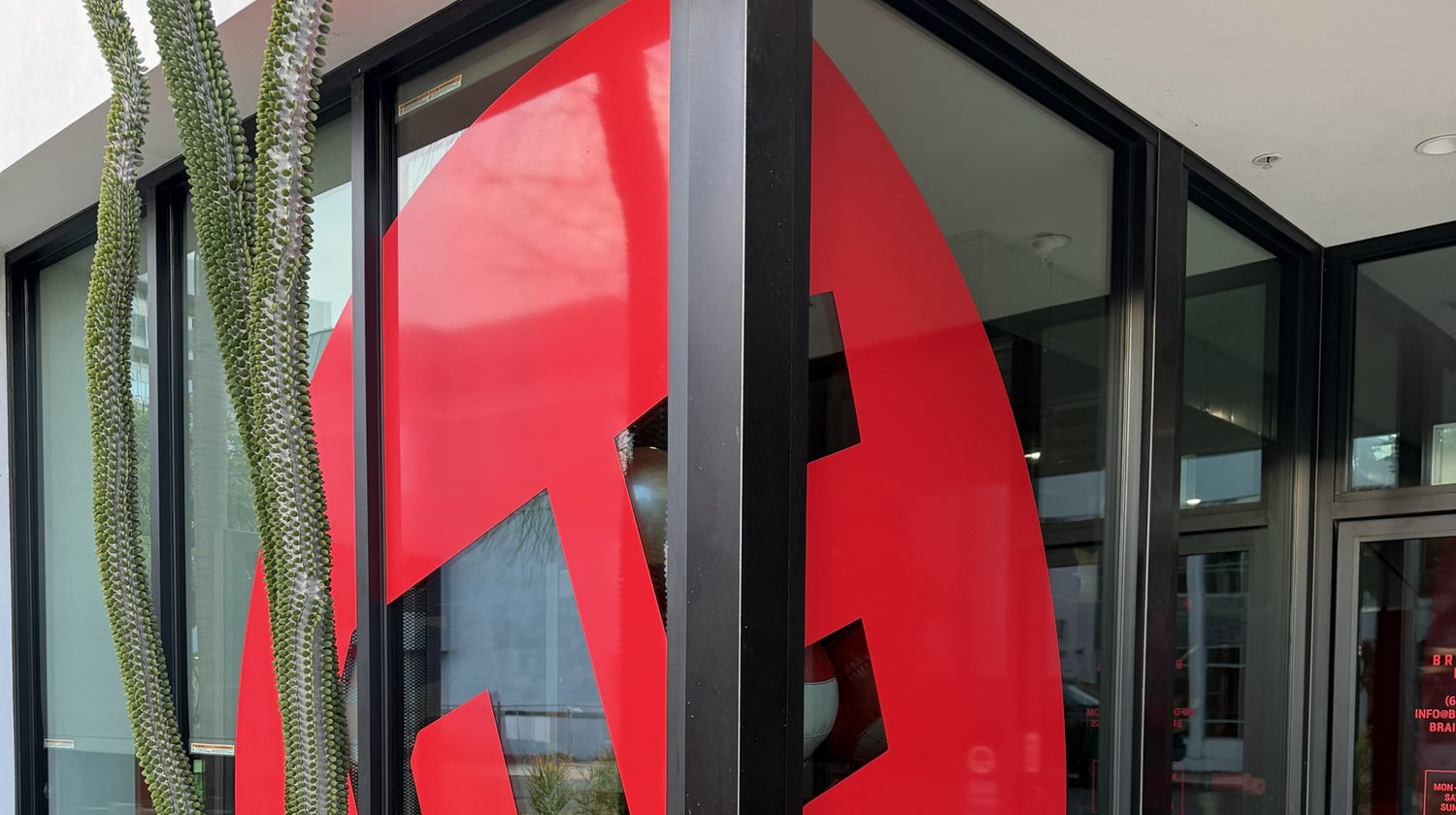 The Brainstorm Fitness storefront on Fifth Avenue, the BF mark in red across the glass